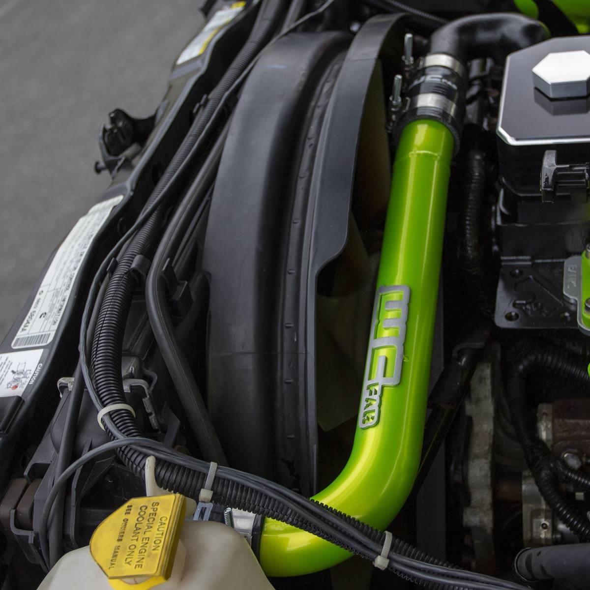 Wehrli 2003-2009 Cummins upper coolant pipe installed with stainless T-bolt clamps