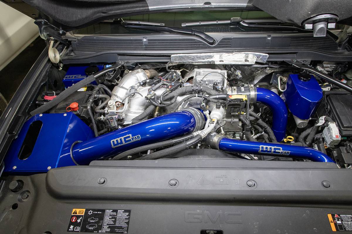 Wehrli Stage 3 High Flow Intake Bundle Kit in a custom Hybrid Blue finish — coolant tank, upper coolant pipe and brake reservoir cover shown are sold separately
