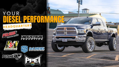 Lifted diesel pickup truck in parking lot with diesel performance parts brand logos