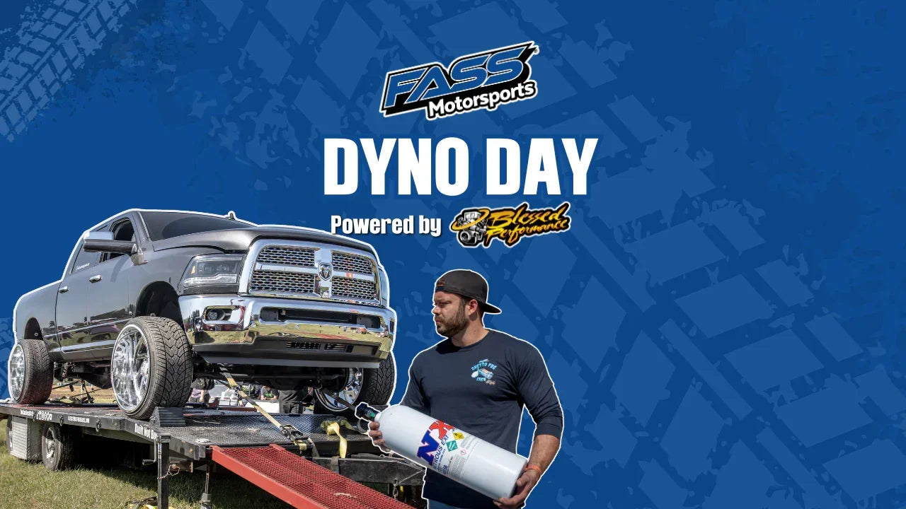 Lifted truck on dynamometer ramp with man holding nitrous oxide tank, Dyno Day event banner