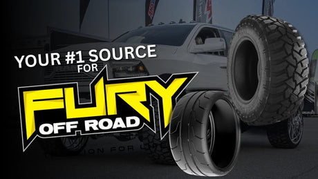 Fury off-road and performance tires with lifted truck in outdoor motorsports setting