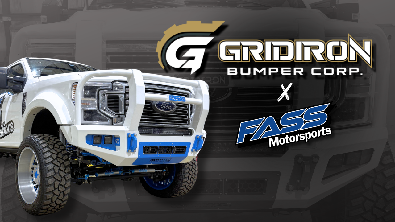 Custom white off-road truck with Gridiron front bumper, logos for Gridiron Bumper Corp and FASS Motorsports.