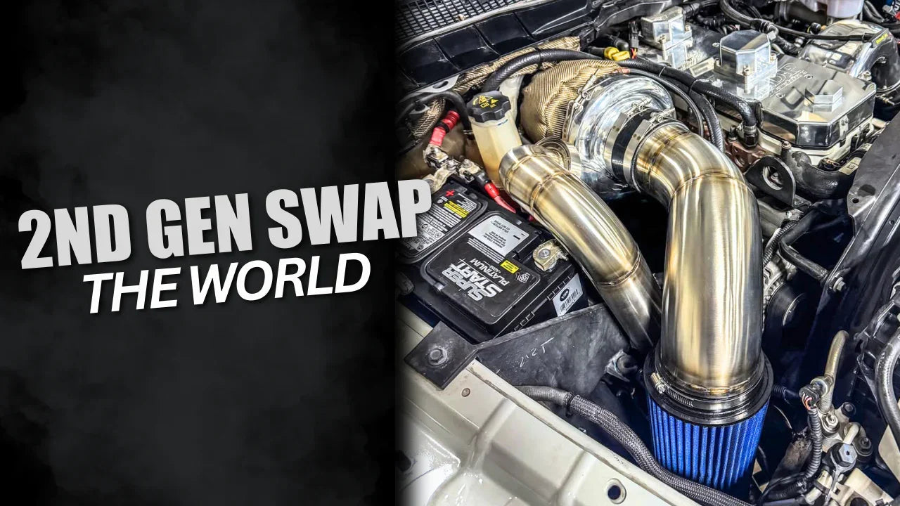 2nd Gen Cummins swap turbo kit with polished intake piping and blue air filter in truck engine bay