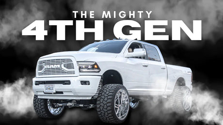 Lifted white 4th gen RAM truck with large off-road tires and smoky background
