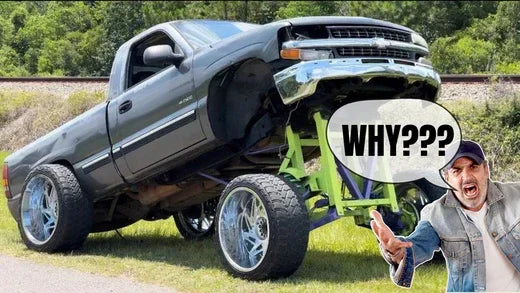 Lifted truck with oversized wheels and damaged front end, man reacting with 'WHY???' text.