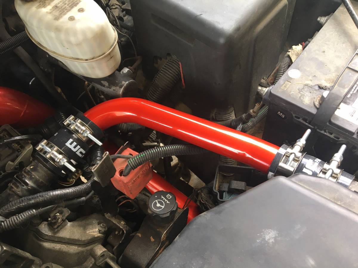 Wehrli upper coolant pipe with silicone boots and stainless T-bolt clamps for the LB7/LLY Duramax