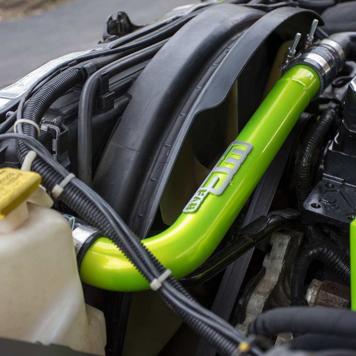 Wehrli upper coolant pipe with bead-rolled ends and silicone boots for the 5.9L and 6.7L Cummins