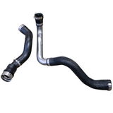 Factory OEM L5P intercooler pipes shown for comparison against the Wehrli Stage 1 kit