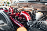 Wehrli 5.9L Cummins intake horn and intercooler pipe kit in WCFab Red with gloss black tags
