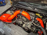 Wehrli 3 inch passenger (cold) side intercooler pipe for 2004.5-2005 LLY Duramax in Fluorescent Orange