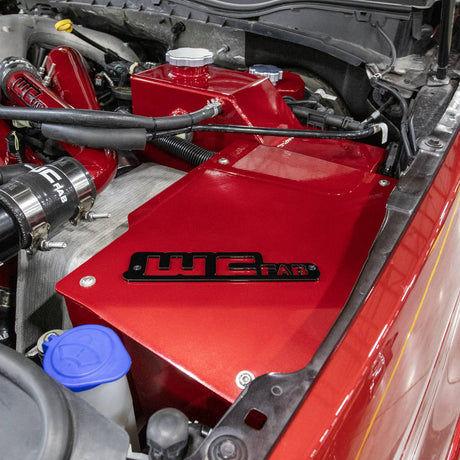 Wehrli Power Stroke coolant tank and battery box in a custom color with gloss black tag and clear anodized cap