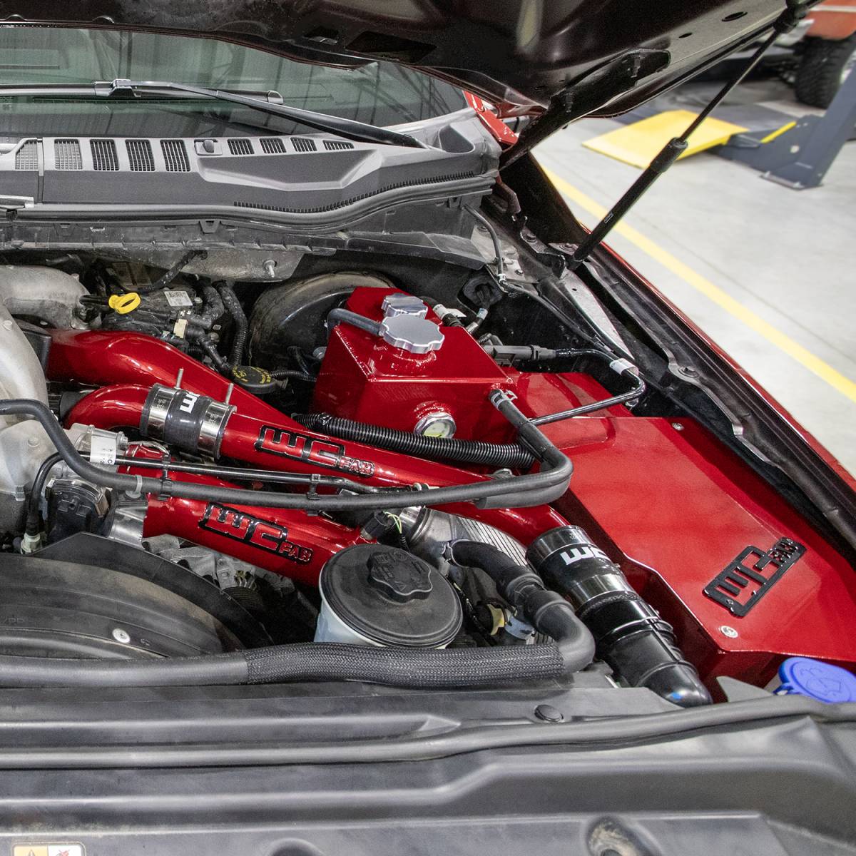 Wehrli Power Stroke coolant tank and battery box installed in the engine bay