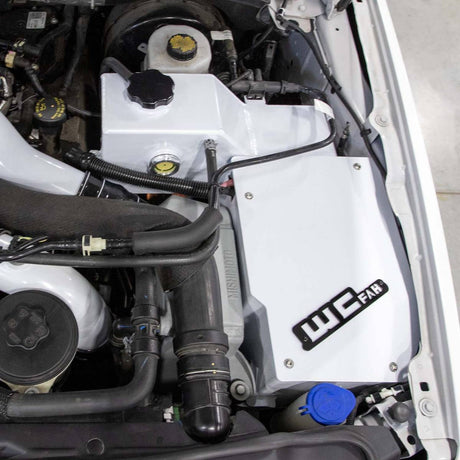 Wehrli Power Stroke coolant tank and battery box in Gloss White with gloss black tag