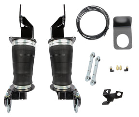A set of black long travel airbags with mounting brackets and hardware for a Ford F250/F350 suspension system.